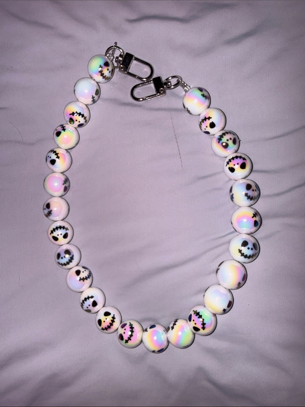 Holographic White Beaded Smile Jack Skellington Bag Chain